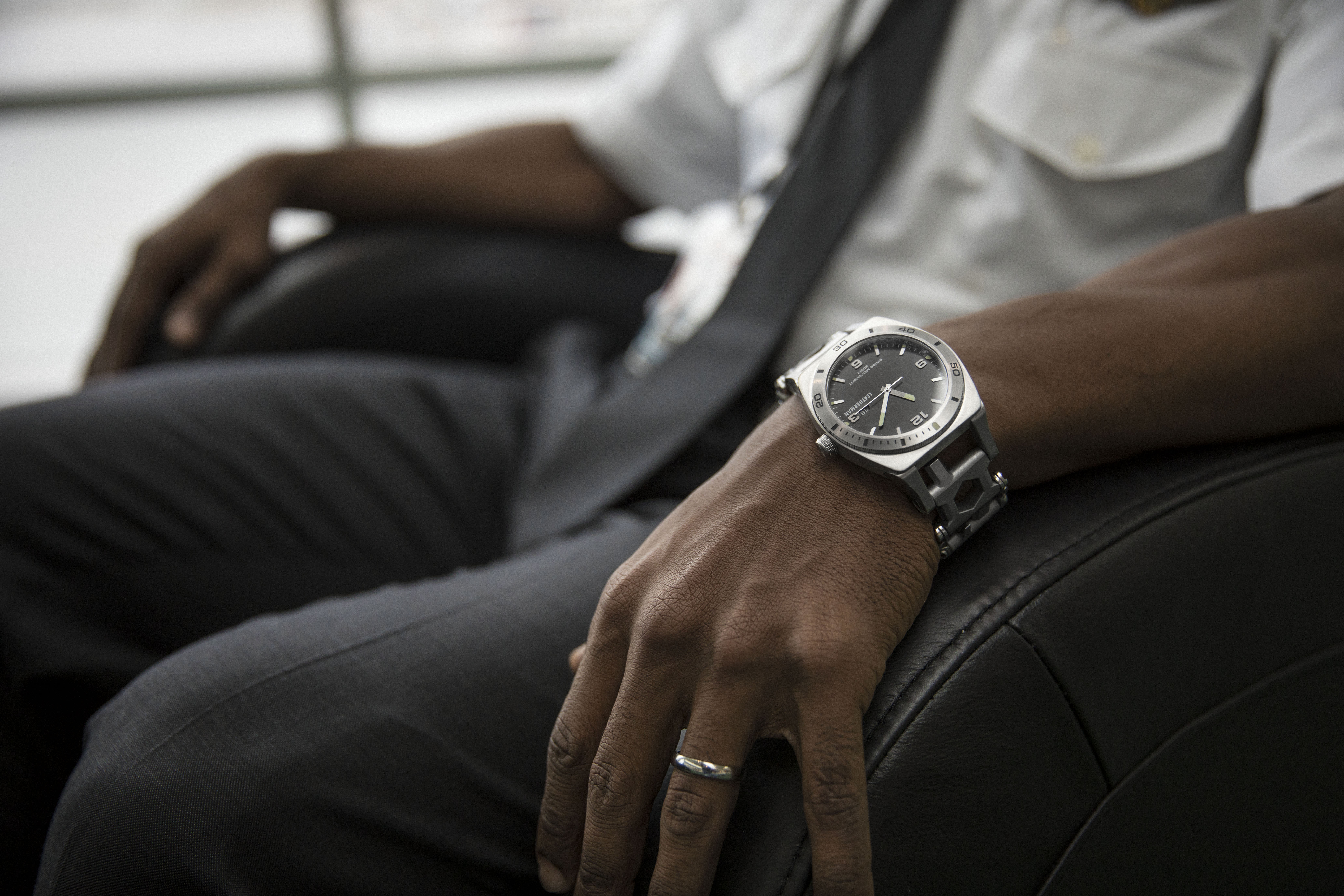 Leatherman tread tempo multi-tool watch on wrist, stainless steel